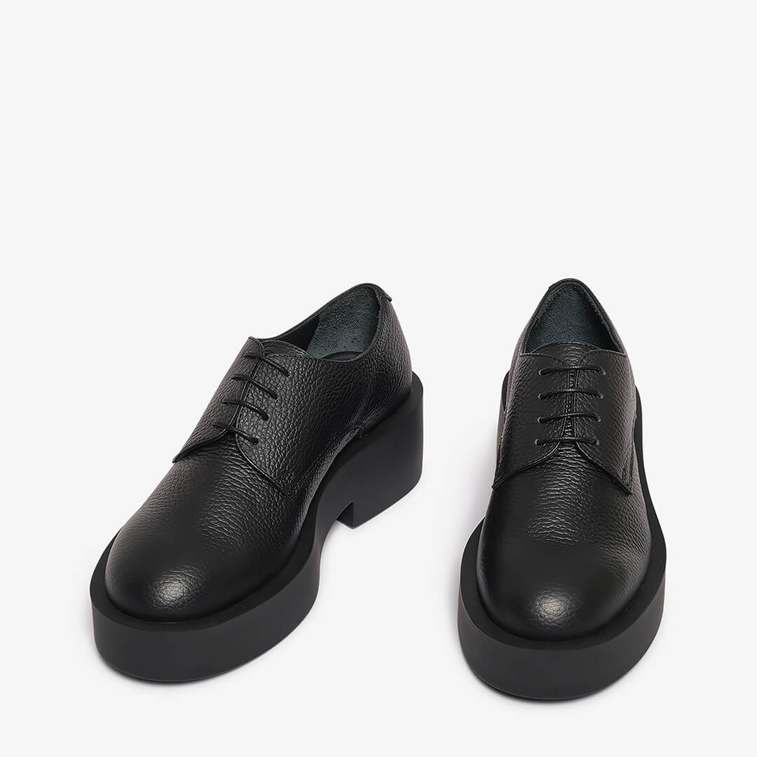 Black women's textured leather derby